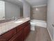 Clean bathroom featuring a vanity with granite countertop and tiled shower at 5286 River Glen Dr # 421, Las Vegas, NV 89103