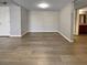 Bright living room featuring modern wood flooring and neutral gray walls at 5286 River Glen Dr # 421, Las Vegas, NV 89103