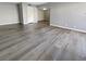Spacious living room showcasing modern gray floors and fresh paint at 5286 River Glen Dr # 421, Las Vegas, NV 89103