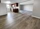 Open floor plan combining kitchen, living and dining area with wood floors and modern appliances at 5286 River Glen Dr # 421, Las Vegas, NV 89103