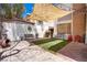 Relaxing backyard area featuring a stylish shade sail, cozy seating, and beautiful landscaping for ultimate outdoor enjoyment at 5325 Sandstone Dr, Las Vegas, NV 89142