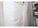 Shower with white tiles and a convenient built-in seat at 5325 Sandstone Dr, Las Vegas, NV 89142