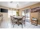 Dining area featuring tile flooring, sliding door access to backyard, and large windows for natural light at 5325 Sandstone Dr, Las Vegas, NV 89142