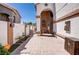 Inviting entrance featuring a landscaped walkway and decorative elements leading to the front door at 5325 Sandstone Dr, Las Vegas, NV 89142