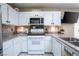 Clean and functional kitchen featuring white cabinetry, a range, and ample counter space at 5325 Sandstone Dr, Las Vegas, NV 89142