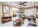 Spacious living room area that includes a fireplace, tile flooring, and natural light at 5325 Sandstone Dr, Las Vegas, NV 89142