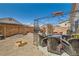 Desert backyard with gravel landscaping, a grill, an outdoor dining area, and a seating area at 5353 Dandelion Ct, North Las Vegas, NV 89031