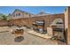 Outdoor space featuring a brick wall, BBQ grill, and space for outdoor entertaining and grilling, perfect for gatherings at 5353 Dandelion Ct, North Las Vegas, NV 89031