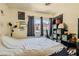 Bedroom with a bed and a window and shelves with storage bins at 5353 Dandelion Ct, North Las Vegas, NV 89031