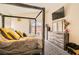 Spacious primary bedroom features vaulted ceiling, carpet flooring, wooden dresser and TV on wall at 5353 Dandelion Ct, North Las Vegas, NV 89031