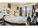 Bedroom featuring a cozy bed, bright natural light, and personal decorations at 5353 Dandelion Ct, North Las Vegas, NV 89031
