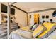 Spacious primary bedroom features vaulted ceiling, carpet flooring, wooden dresser, wall decorations and ensuite access at 5353 Dandelion Ct, North Las Vegas, NV 89031