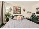 Bedroom featuring a comfortable bed, desk, and serene decor at 5353 Dandelion Ct, North Las Vegas, NV 89031