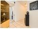Light-filled entryway with tile flooring and display shelving at 5353 Dandelion Ct, North Las Vegas, NV 89031