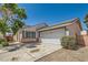 Beautiful single-story home with a two-car garage and minimal desert landscaping at 5353 Dandelion Ct, North Las Vegas, NV 89031