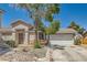 Charming single-story home featuring a two-car garage and low-maintenance desert landscaping at 5353 Dandelion Ct, North Las Vegas, NV 89031