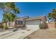 Attractive single-story home boasting a two-car garage and easy desert landscaping at 5353 Dandelion Ct, North Las Vegas, NV 89031