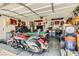 Spacious garage featuring a pool table, bar stools, and a motorcycle at 5353 Dandelion Ct, North Las Vegas, NV 89031