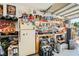 This garage conversion includes shelving, a workbench, fridge, and lots of tools at 5353 Dandelion Ct, North Las Vegas, NV 89031
