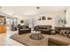 Open-concept living room featuring neutral decor and abundant natural light at 5353 Dandelion Ct, North Las Vegas, NV 89031