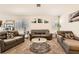 Comfortable living room with contemporary furnishings and large windows at 5353 Dandelion Ct, North Las Vegas, NV 89031