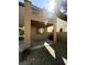 Covered patio and low-maintenance gravel yard create an ideal outdoor living space at 5425 Whisper Bluff St, North Las Vegas, NV 89031