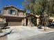 Charming two-story home with a cozy porch, attached garage and drought resistant landscaping at 5425 Whisper Bluff St, North Las Vegas, NV 89031
