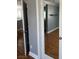 Hallway with doors leading to bathroom and bedroom and hardwood floors at 5425 Whisper Bluff St, North Las Vegas, NV 89031