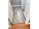 Laundry room with grey stone-look tiling, white baseboards, and white appliances at 5425 Whisper Bluff St, North Las Vegas, NV 89031