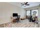 Bright bedroom featuring desk, exercise equipment, and ceiling fan at 5588 Holcomb Bridge Ct, Las Vegas, NV 89149