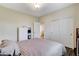 Bedroom featuring double closets and wood floors at 5588 Holcomb Bridge Ct, Las Vegas, NV 89149