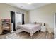 Cozy bedroom featuring a metal bed frame and wood floors at 5588 Holcomb Bridge Ct, Las Vegas, NV 89149