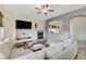 Cozy living area with a fireplace, TV, and ample seating for entertaining guests at 5588 Holcomb Bridge Ct, Las Vegas, NV 89149