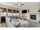 Bright living room featuring a fireplace, large windows, and hardwood floors at 5588 Holcomb Bridge Ct, Las Vegas, NV 89149