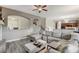 Comfortable living area with a large sectional sofa, fireplace, and hardwood floors at 5588 Holcomb Bridge Ct, Las Vegas, NV 89149