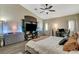 Spacious main bedroom features wood floors, vaulted ceiling, and ceiling fan at 5588 Holcomb Bridge Ct, Las Vegas, NV 89149