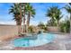 Pool with waterfall, spa, and landscaping, creating a private backyard retreat for relaxation and entertainment at 5588 Holcomb Bridge Ct, Las Vegas, NV 89149