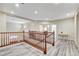 Bright upstairs landing area with wood floors, wood railing and views of other rooms at 5588 Holcomb Bridge Ct, Las Vegas, NV 89149