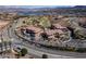 Upscale community with a manicured golf course, lake views, and multiple elegant homes at 6 Via Vasari # 105, Henderson, NV 89011