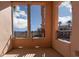Balcony showcasing scenic views of a pool, mountains, and palm trees at 6 Via Vasari # 105, Henderson, NV 89011