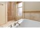 Bright bathroom featuring a separate shower and tub with tile accents at 6 Via Vasari # 105, Henderson, NV 89011