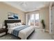 Bedroom with a balcony, neutral decor, and a ceiling fan at 6 Via Vasari # 105, Henderson, NV 89011