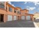 Property with multiple garage doors each with carriage hardware at 6 Via Vasari # 105, Henderson, NV 89011