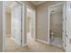 Hallway featuring several doorways leading to different rooms, showcasing the layout and flow of the home's interior at 6 Via Vasari # 105, Henderson, NV 89011