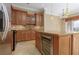 Spacious kitchen with stainless steel appliances, wine cooler, granite island, and ample storage, perfect for cooking at 6 Via Vasari # 105, Henderson, NV 89011