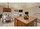 Spacious living and dining area with island, fireplace and access to outdoor living at 6 Via Vasari # 105, Henderson, NV 89011
