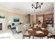 Open concept living and dining area with fireplace at 6 Via Vasari # 105, Henderson, NV 89011