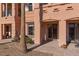Beautiful back patio area with a tiled walkway and views of the building's exterior at 6 Via Vasari # 105, Henderson, NV 89011