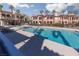Beautiful community pool area with lounge chairs and views of the surrounding buildings at 6 Via Vasari # 105, Henderson, NV 89011