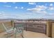 Enjoy stunning city views from this balcony featuring chairs and decorative concrete finish at 640 Finch Island Ave, Henderson, NV 89015